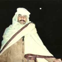 a-bicyclist-taking-a-break-under-a-moon-in-lahore-pakistan-1993